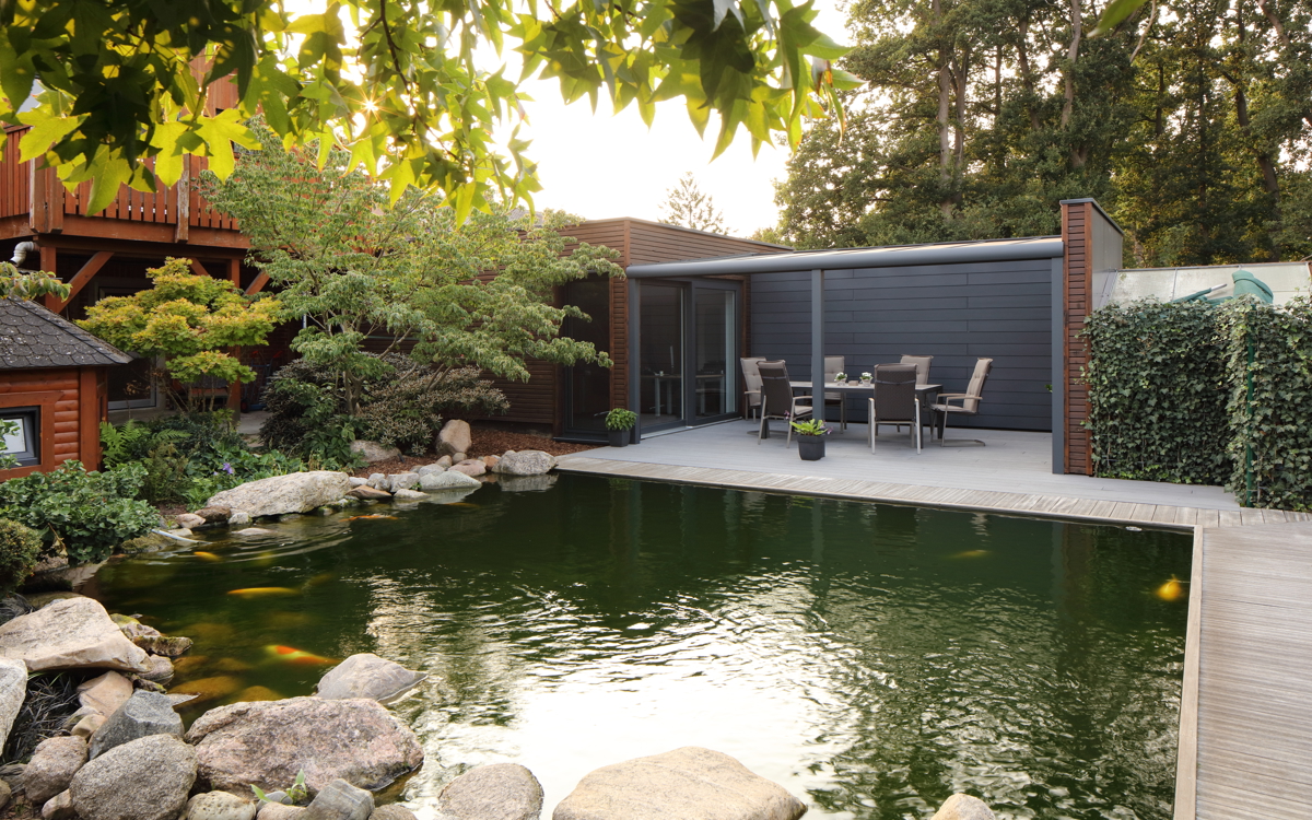 Relaxing at the koi pond on a Cedral Terrace in Sulingen