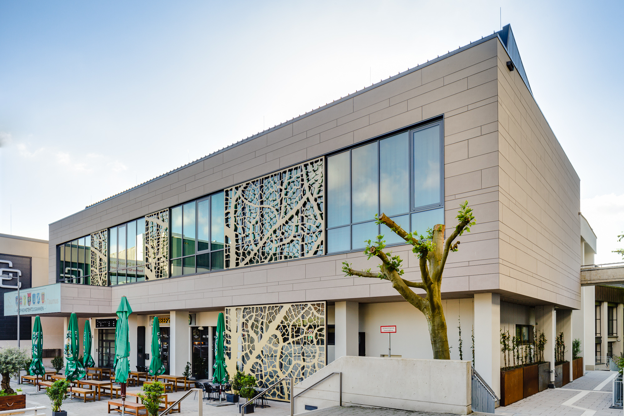 Cityhall Hofheim featuring EQUITONE [lunara] LA20 fibre cement panels in a regular finish with integrated cut-out screens, designed by Kulla Architekten, Germany.